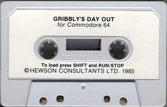 A grey cassette tape , label reads 'GRIBBLY'S DAY OUT for Commodore 64'